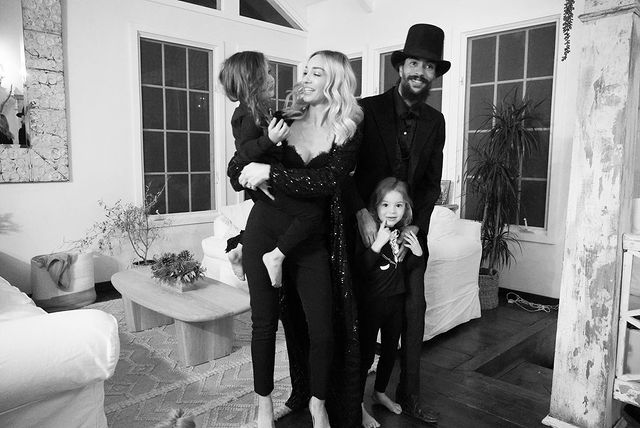 Black and white photo of Ross Naess with his family.